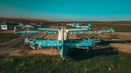 Abandoned aircraft field wirn AN-2 on it