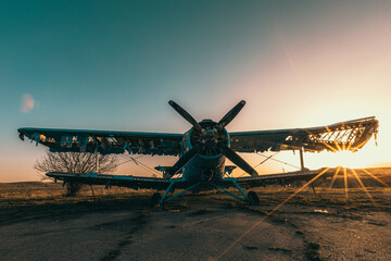 Abandoned aircraft field wirn AN-2 on it
