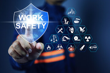 Work safety concept with supervisor pointing to protection shield to remind employees to pay attention to safety while working and wear personal protective equipment.