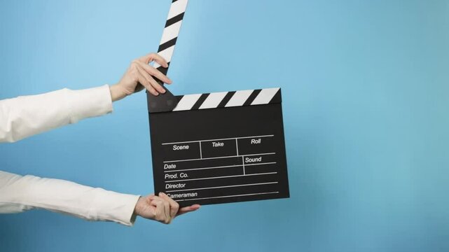 Hollywood-style scene setup, digital media production, action film slate being used