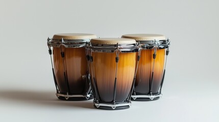 Three conga drums showcase intricate craftsmanship and warm tones in a clean, modern setting emphasizing musical artistry and culture