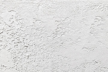 A white wall with a rough texture