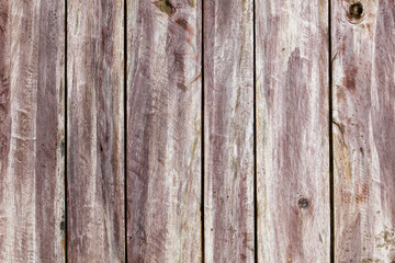A wooden background with a few brown spots