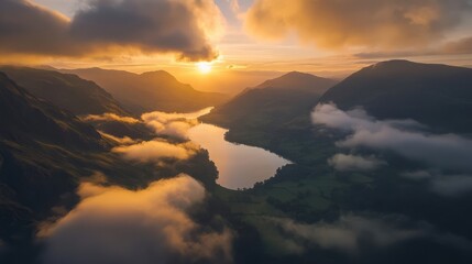 Stunning sunset over calm lake and mountains, surrounded by soft clouds and dramatic colors in the sky.