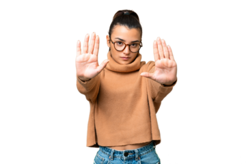 Young beauty woman over isolated chroma key background making stop gesture and disappointed