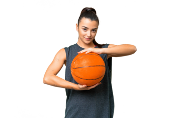 Young beauty woman over isolated chroma key background playing basketball