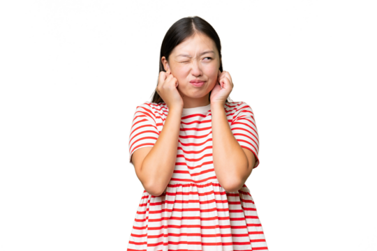 Young Asian woman over isolated background is a little bit nervous