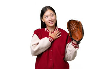 Young asian woman with baseball glove over isolated background looking up while smiling