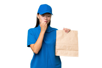 Young Asian woman taking a bag of takeaway food over isolated background having doubts