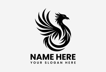 Fototapeta premium Majestic black phoenix with spread wings rising from flames, mythical rebirth emblem for powerful branding