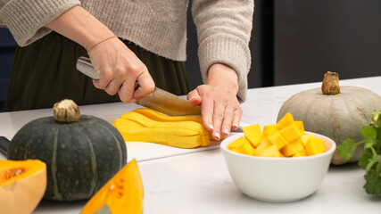 Preparing fresh butternut squash for autumn cooking and healthy meals. Autumn