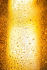 background texture for background bright orange, yellow, sunny color, peach color with shimmering elements and flowing drops on glass, beautiful bright background with overflows and gradient