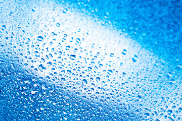 background texture for background bright blue water and sea with shimmering elements and flowing drops on glass, beautiful bright background with iridescent and gradient