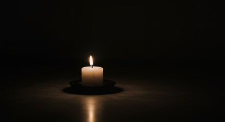 Burning Candle in Dark Setting