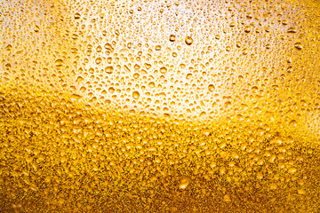 background texture for background bright orange, yellow, sunny color, peach color with shimmering elements and flowing drops on glass, beautiful bright background with overflows and gradient