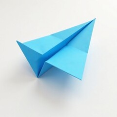Simple blue origami paper airplane against a plain white background, fly, clean