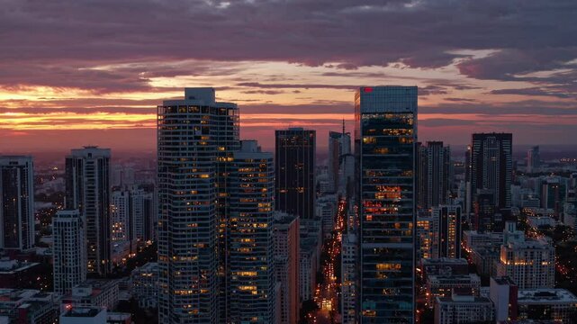 Vibrant sunset illuminating brickell key and downtown miami skyline