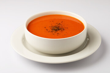 bowl of tomato soup with parsley