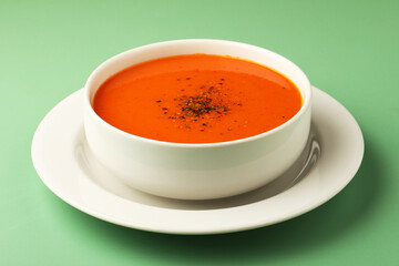 bowl of tomato soup with parsley