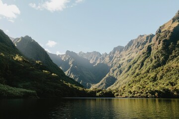 Fototapeta premium Lush valley, serene lake, mountains