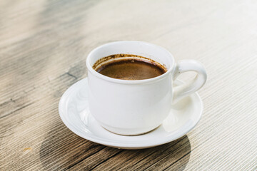 cup of coffee on wooden table