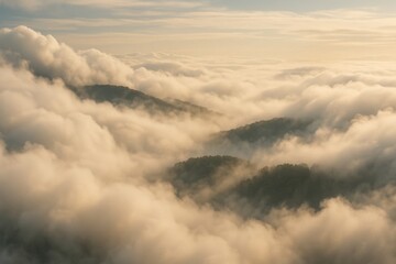 Mountain peaks emerging through dense clouds at sunrise, creating a dreamy, ethereal atmosphere.