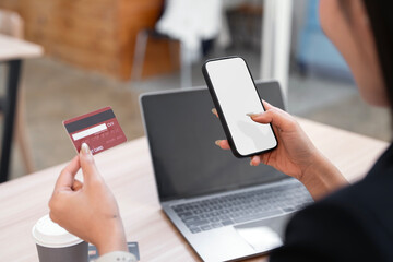 Online payment, Hands of woman holding mobile phone and using credit card for online shopping