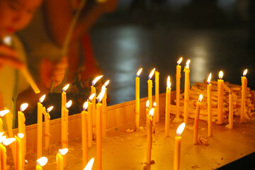 Flickering Candlelight in a Serene Spiritual Setting at Night