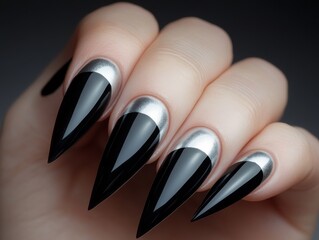 Elegant matte black nail art with structured silver accents is a chic urban choice for those who love fashion