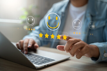 Customer satisfaction survey concept, Man using laptop touch happy smiley icon, 5 star service...
