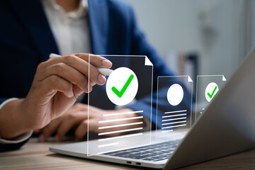 Online survey and checklist assessment, Digital questionnaire, Businessman use tablet to complete a...