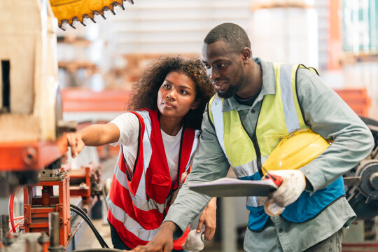 African American industrial experts inspection collaborate in factory, machinery technical planning, production management, teamwork strategies, workflow coordination, mechanical expertise innovation