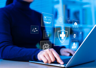 Healthcare and Medical Technology Concept. Person using laptop with virtual medical interface...