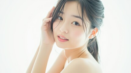 Fototapeta premium Captivating Portrait of a Young Woman with Soft Features in a Light-Filled Environment