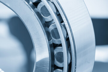 Close up scene the cylindrical rolling bearing parts in the light blue scene.