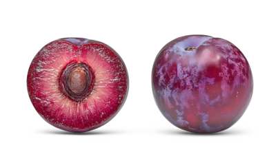 Two plums, one whole and one cut in half, showing vibrant red-purple flesh and light brown pit with smooth skin.
