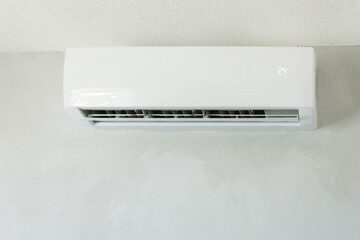 Air conditioner unit cooling a room, showing 24 degrees on display