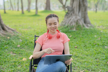 Woman uses iPad to listen to music outdoors