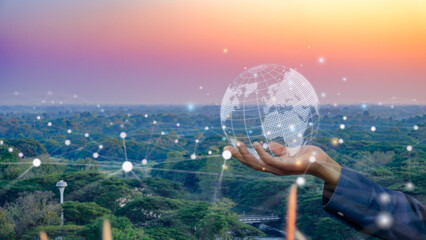 Businessman hand holding global network, customer data connection and modern innovation abstract with nature view background with network lines.