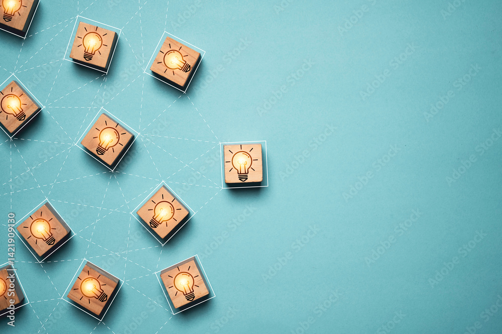 Poster glowing light bulb linkage on wooden block cube with copy space for brainstorming to creative thinki