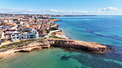 Obraz premium Aerial view of Torre de la Horadada, Spanish town located on Mediterranean Sea. Costa Blanca. Spain