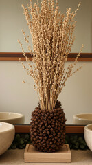 dried flower arrangement in a textured brown vase