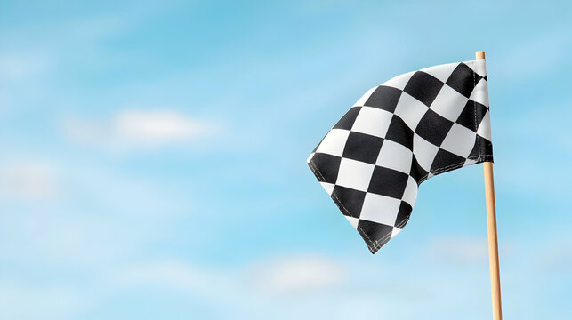 Black And White Checkered Finish Line Flag Against A Blue Sky