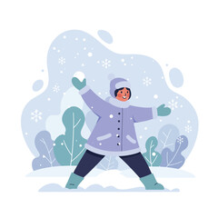 Fototapeta premium Child playing in snowy winter landscape with coat and mittens enjoying outdoors fun and snowflakes falling 