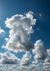 Obraz premium Majestic cumulus clouds floating in a brilliant azure expanse under sunshine