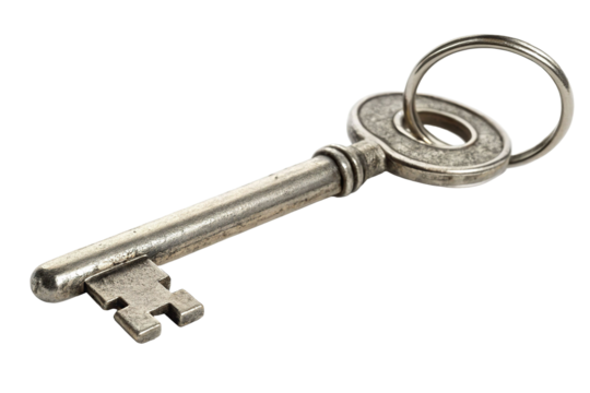 Intricate silver key rests on a plain surface revealing its vintage design and potential for unlocking secrets