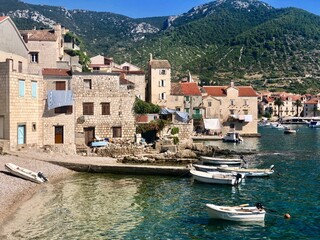 The beautiful town and harbor of Komiza, Island Vis, Dalmatia, Croatia