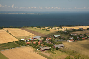 Obraz premium View of the village and the lake shore from the top of the hill