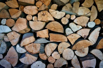 Fototapete Rund Wooden logs with visible growth rings and rich textures create a warm, rustic pattern. This composition reflects sustainability, the beauty of nature, eco-conscious living, making it ideal for design © Nebojsa
