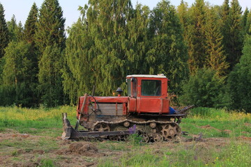 old soviet agricultural tractor for plowing land